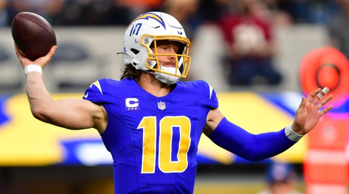 Chargers quarterback Justin Herbert throws a pass during a game.